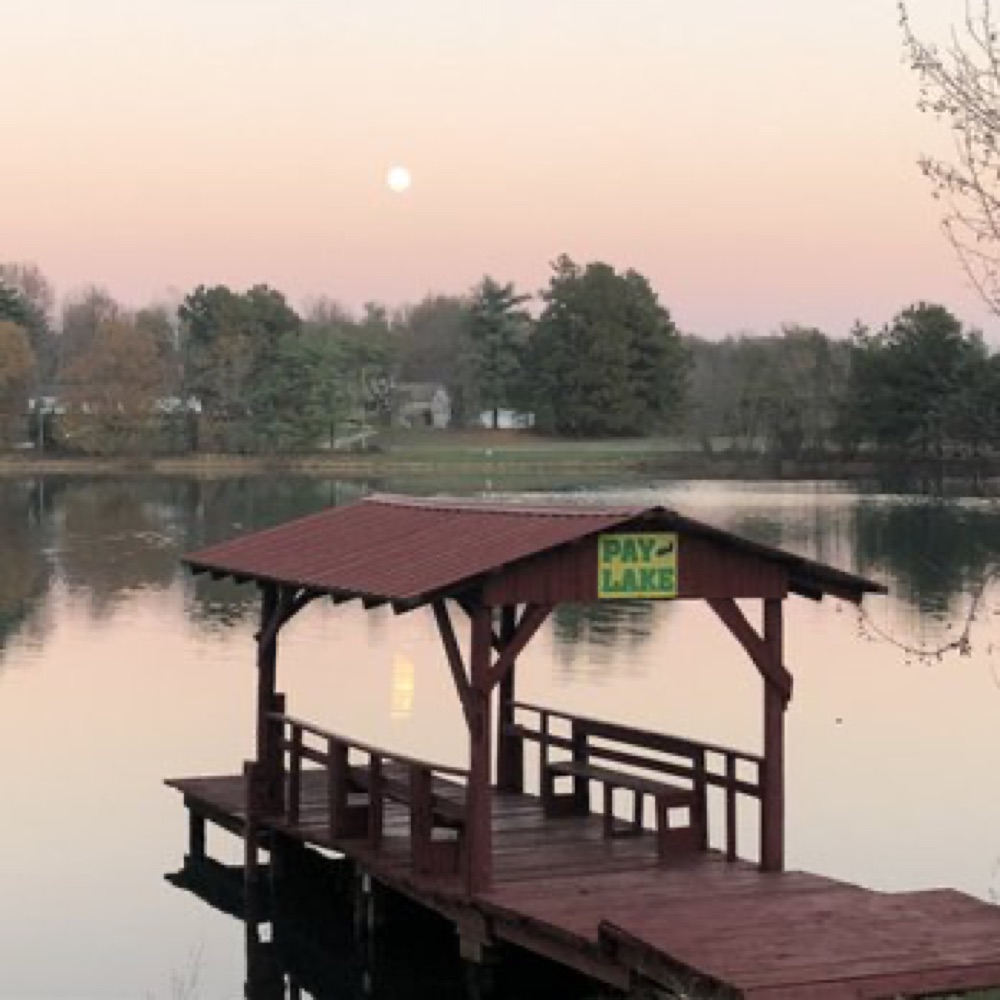 The pay-lake fishing pier at sunset